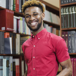 Men smiling in a library