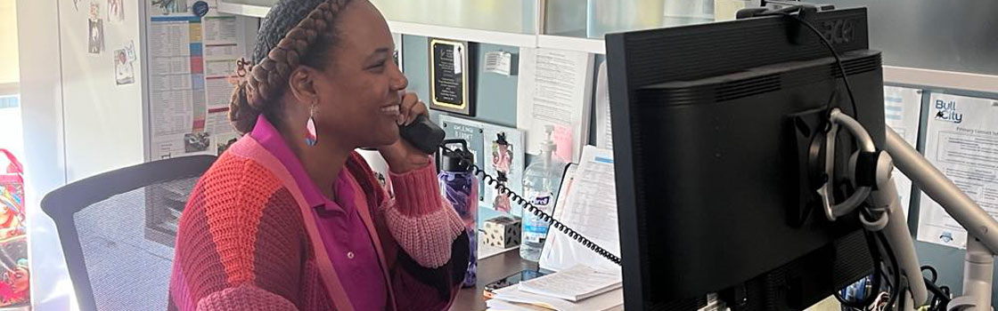 Bus Ops team member on phone