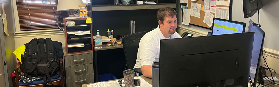 FM doing plan review at desk