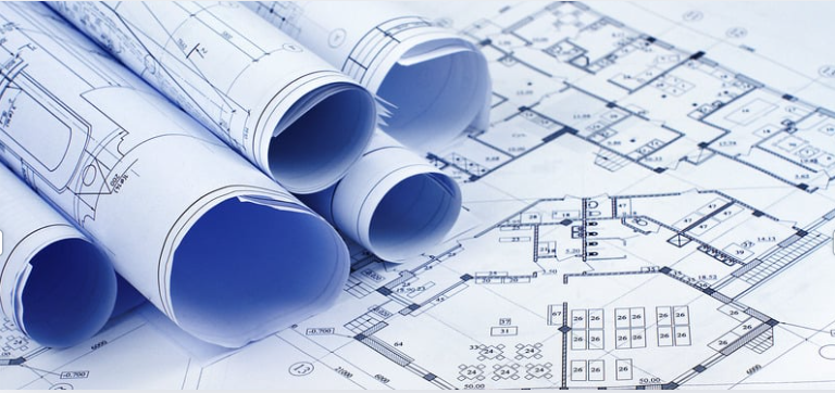 Image of blueprints rolled up and laid out.