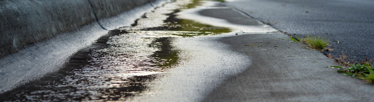 water flowing in road after a storm slowly.