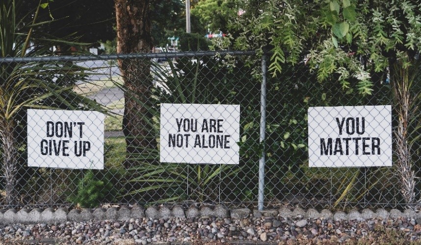 Signs saying Don't Give Up, You Are Not Alone, You Matter
