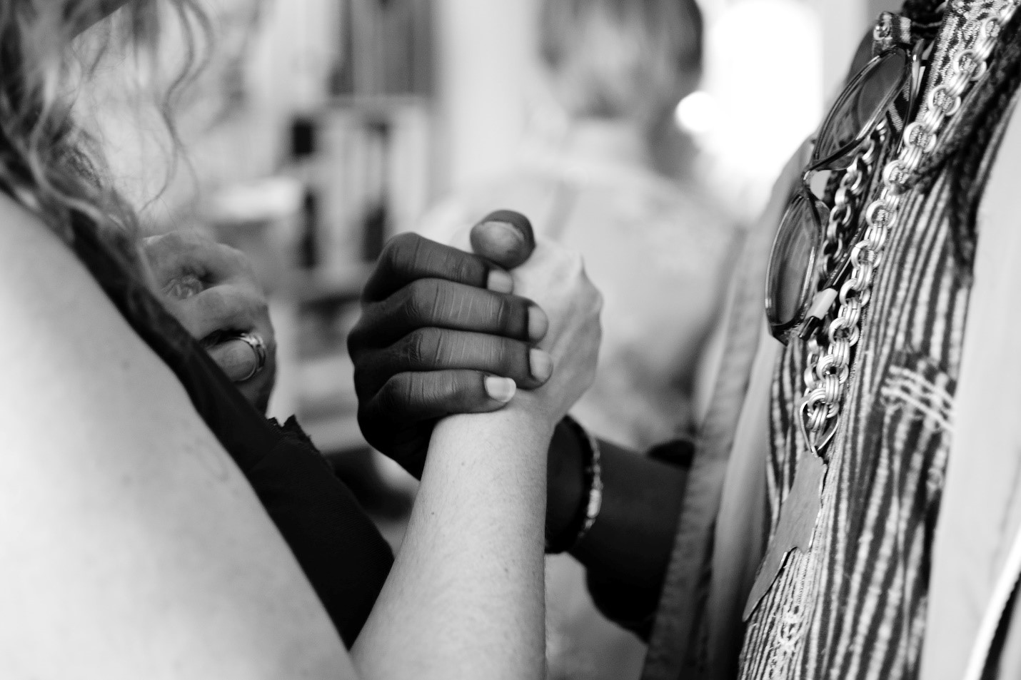 Two people clasping hands