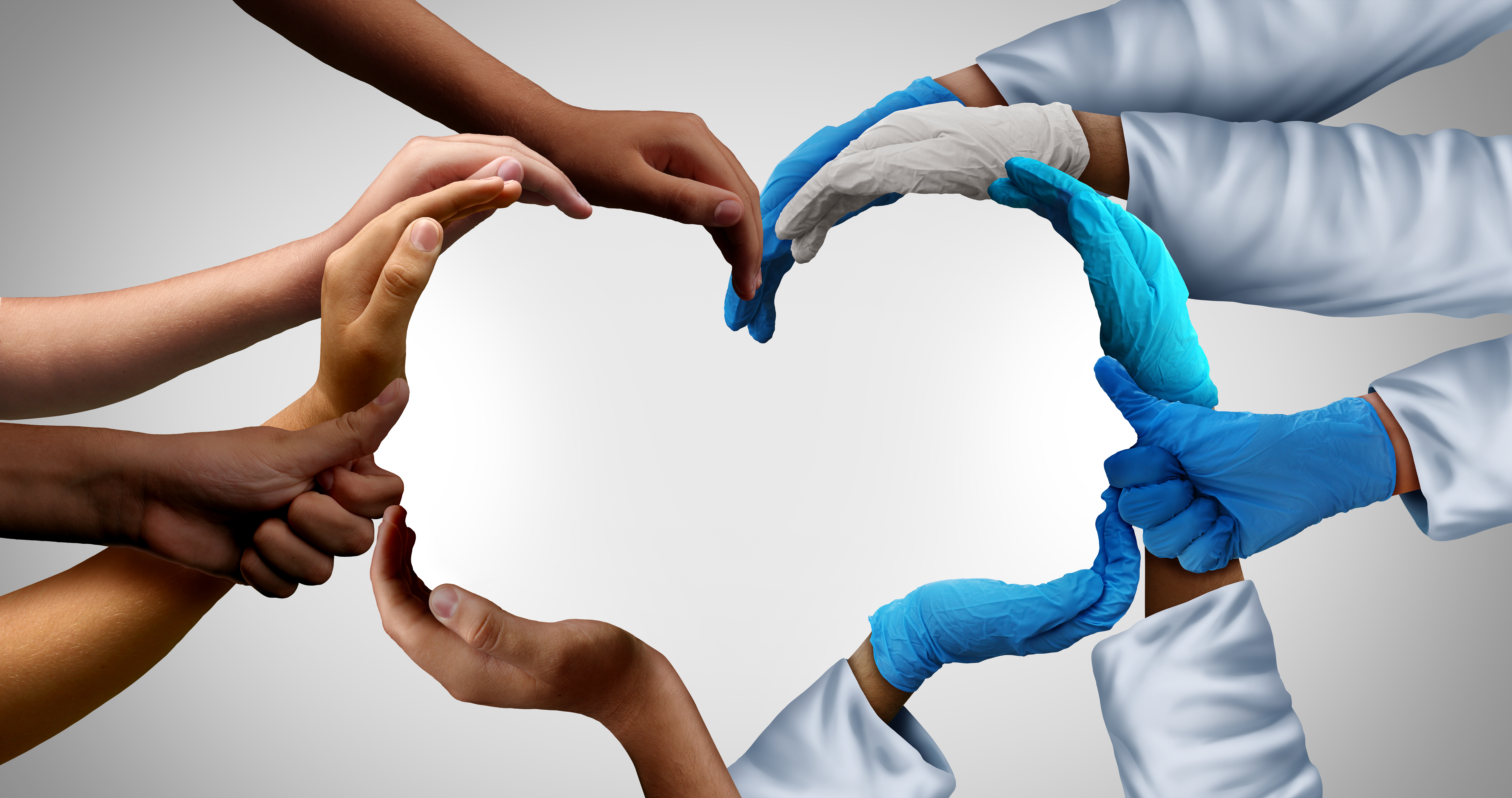 People's hands coming together to form a heart
