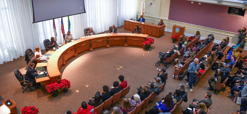 A session of the Board of County Commissioners, shot from above.