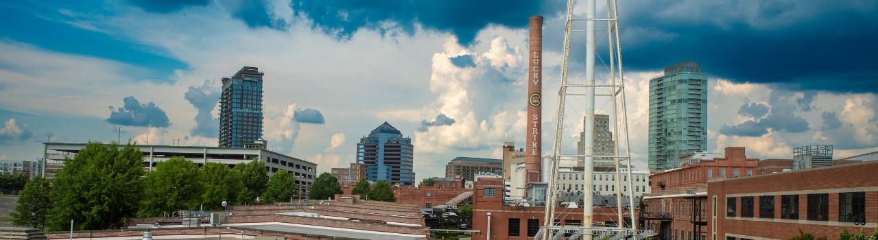 A photo of downtown Durham from above with a view of the American Tobacco Campus