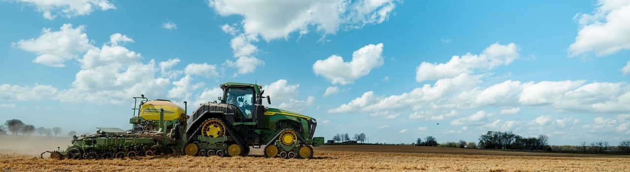 Tractor planting corn.